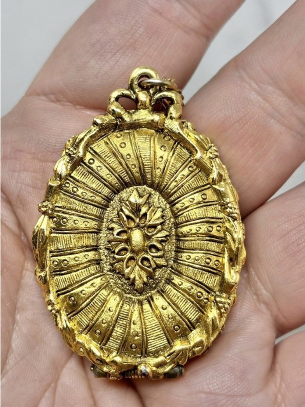 Disney Gold Sunburst Oval Pendant Necklace needs polishing